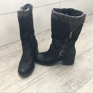 Black boots with builtin appearance of a sock.